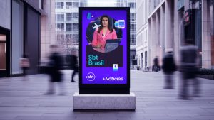 Image of a +SBT Informaçao, a news channel, poster on a Sao Paulo street (mockup).